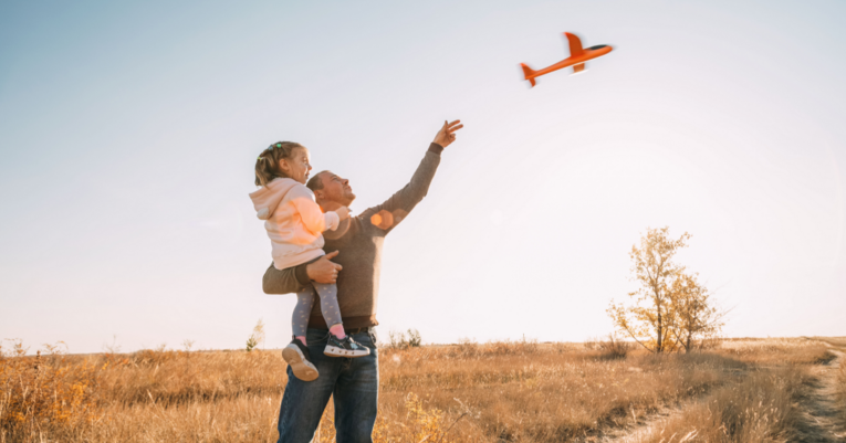dad and daudgter in a field